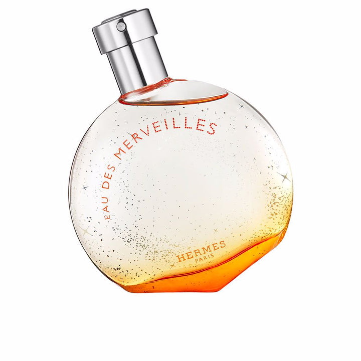 Rounded glass bottle of amber-hued eau de parfum, 50 ml, woody amber notes