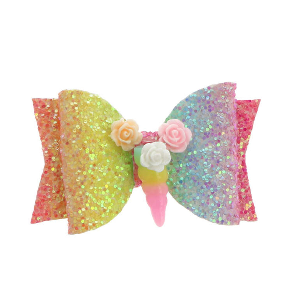 Inca Multicolor glittery fabric hair bow with flower accents and unicorn horn on plastic clip