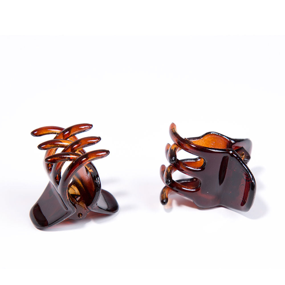 Inca Set of two small brown translucent plastic shell hair claw clips with curved prongs and spring hinge