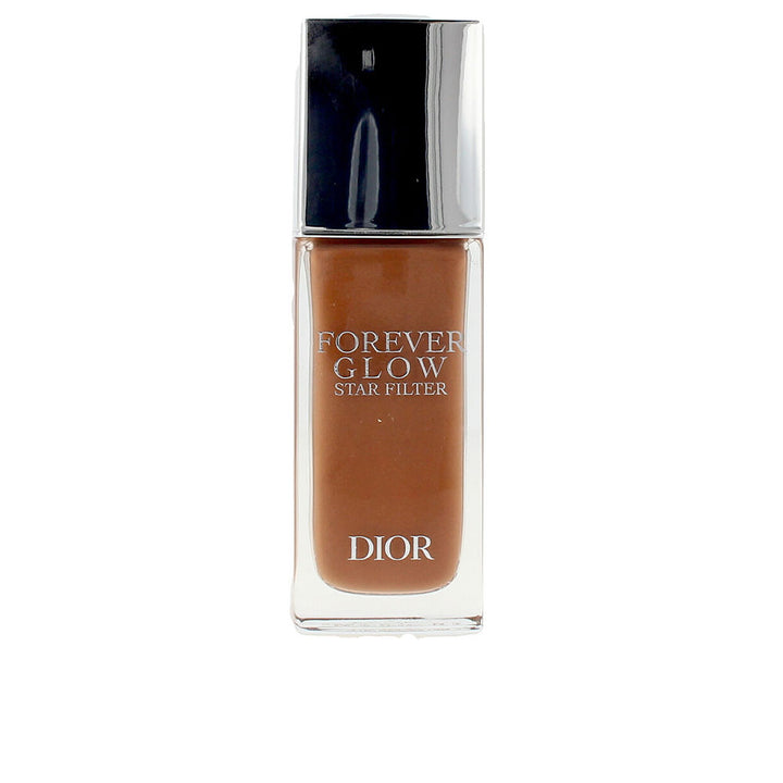 Slim glass bottle with pearlescent pale-beige luminous fluid, dispenser cap