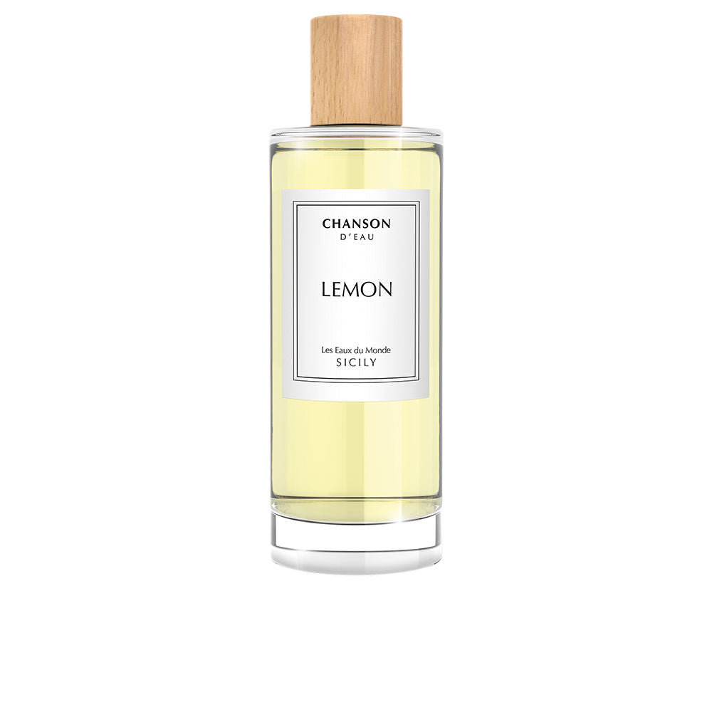 Clear 100 ml perfume bottle with yellow citrus fragrance, minimalist label