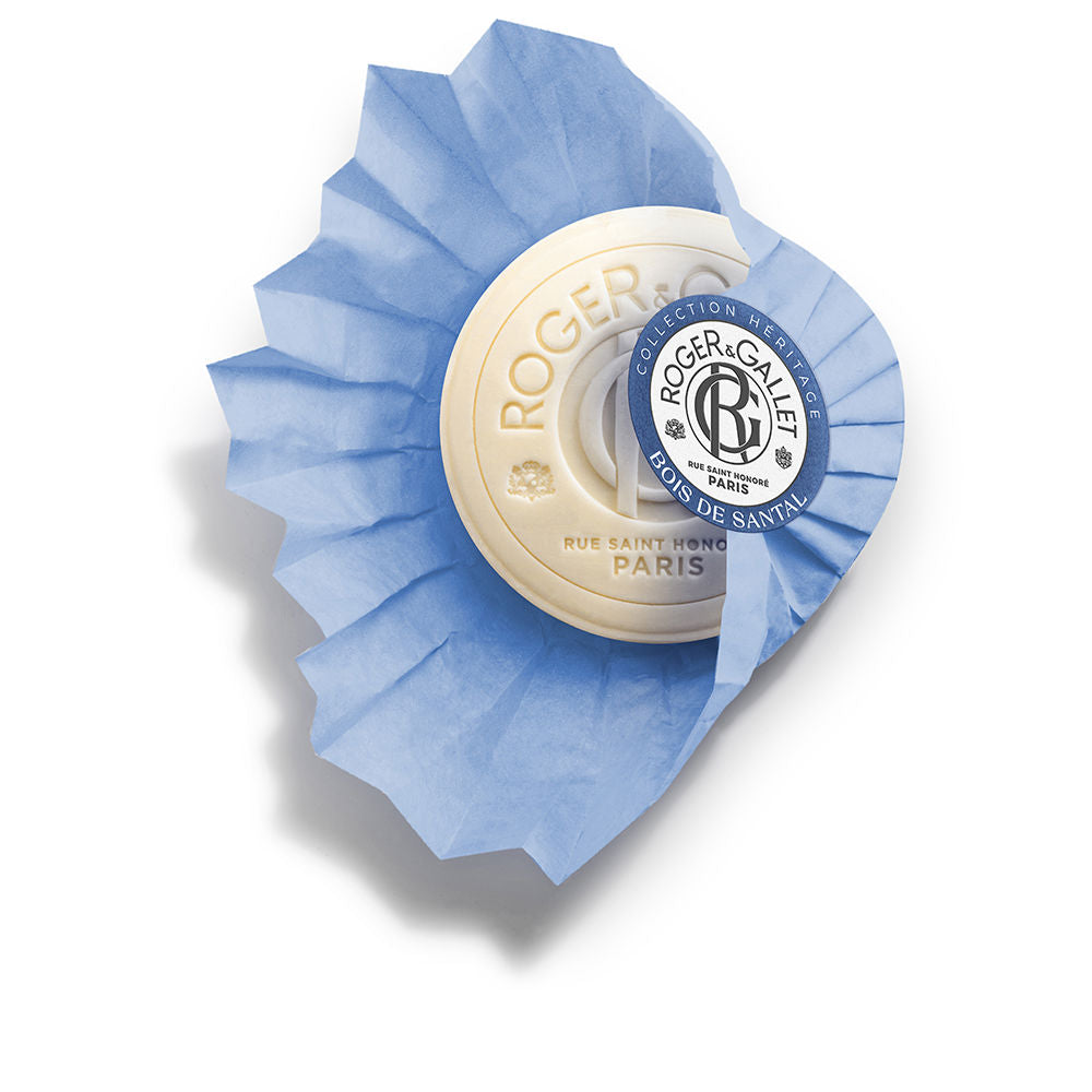 Cream and blue round soap wrapped in pleated paper with embossed text and circular label, Roger & Gallet