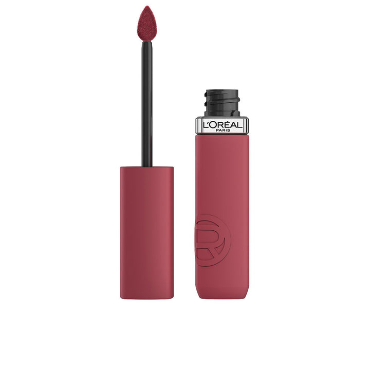 Tube of matte liquid lipstick in muted red, slim applicator visible