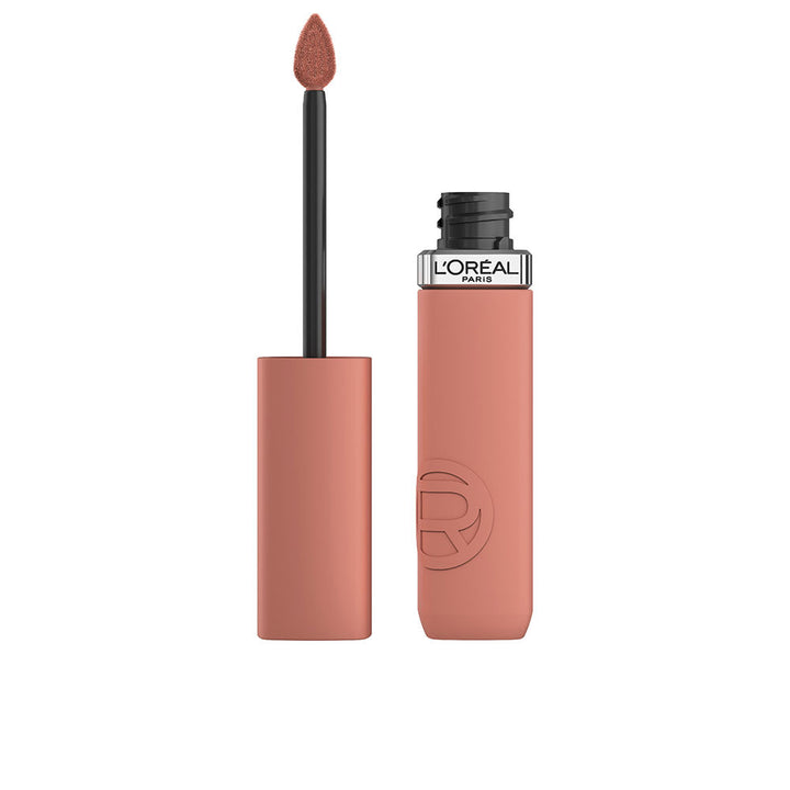 Slim tube of lightweight matte liquid lipstick in beige shade, applicator visible