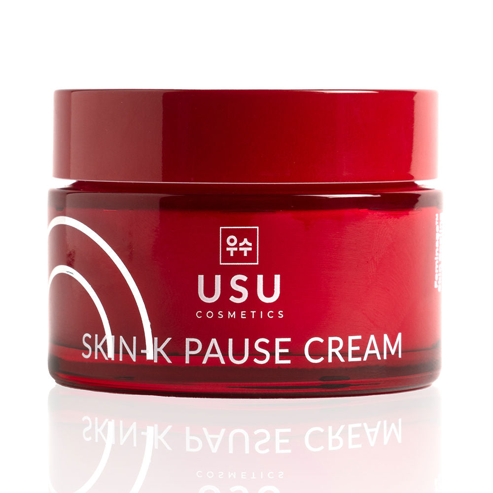 Red minimalist cylindrical plastic jar with white printed text and curved lines, screw-on lid, Usu