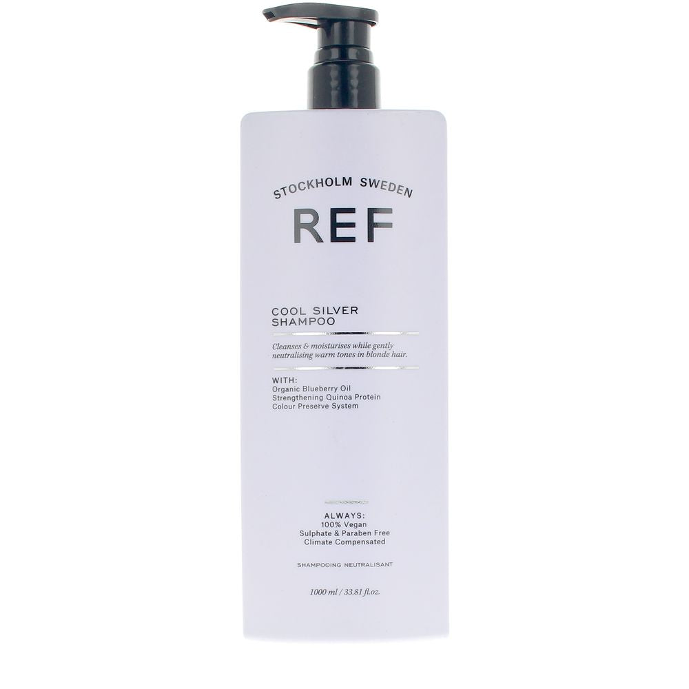 Tall 1,000 ml bottle of violet-blue cool silver shampoo for blondes and grey hair