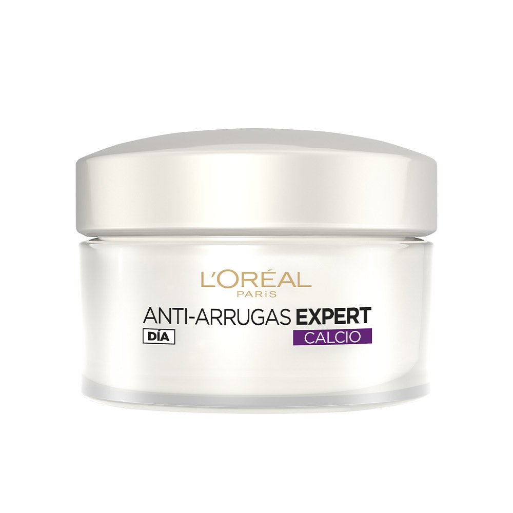 L'Oréal Paris White face cream in round plastic jar with screw-on lid, purple label and gold, black printed text
