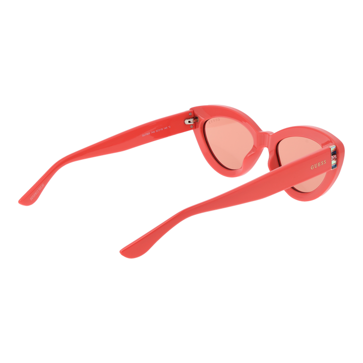 Coral pink cat-eye sunglasses with tinted lenses and decorative temples on white background