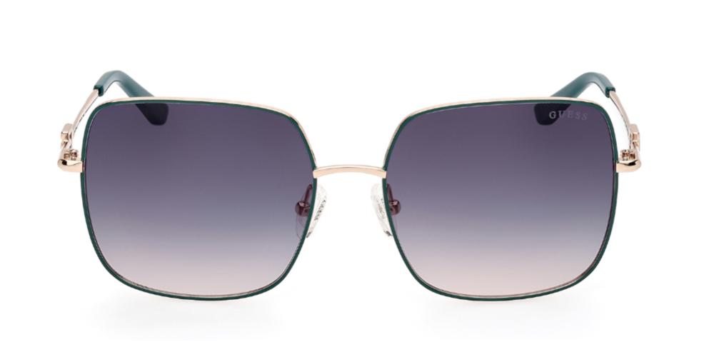 Gold metal square sunglasses with green to purple gradient lenses and decorative temple logo, nose pads visible