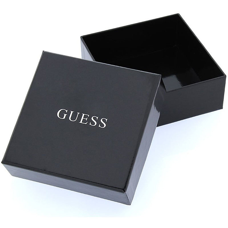Silver ring with embedded crystals and dangling key charm with heart cutout beside a black presentation box
