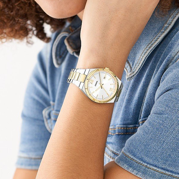 Two-tone silver and gold analog dress watch with white dial and fluted bezel