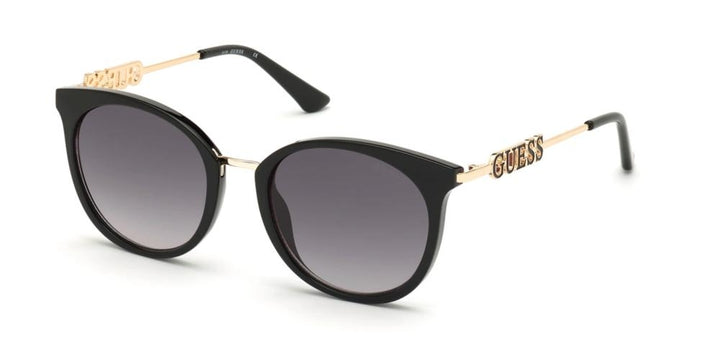 Black cat-eye sunglasses with gold temple arms, gradient lenses and logo on temples, leather case included