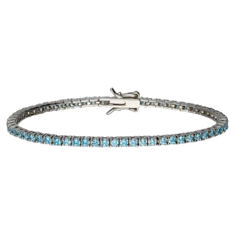 Stroili Silver Tennis Bracelet: bracelet with linked settings and blue gemstones draped on a neutral surface, clasp visible